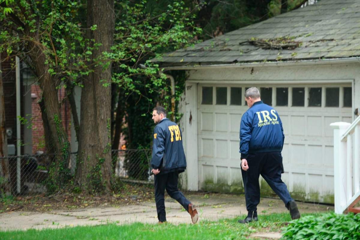 Federal Bureau of Investigation, and Internal Revenue Service agents search the home of Baltimore Mayor Catherine Pugh in Baltimore, Md., Thursday, April 25, 2019. Agents with the FBI and IRS are gathering evidence inside the two homes of Baltimore Mayor Catherine Pugh and in city hall,
