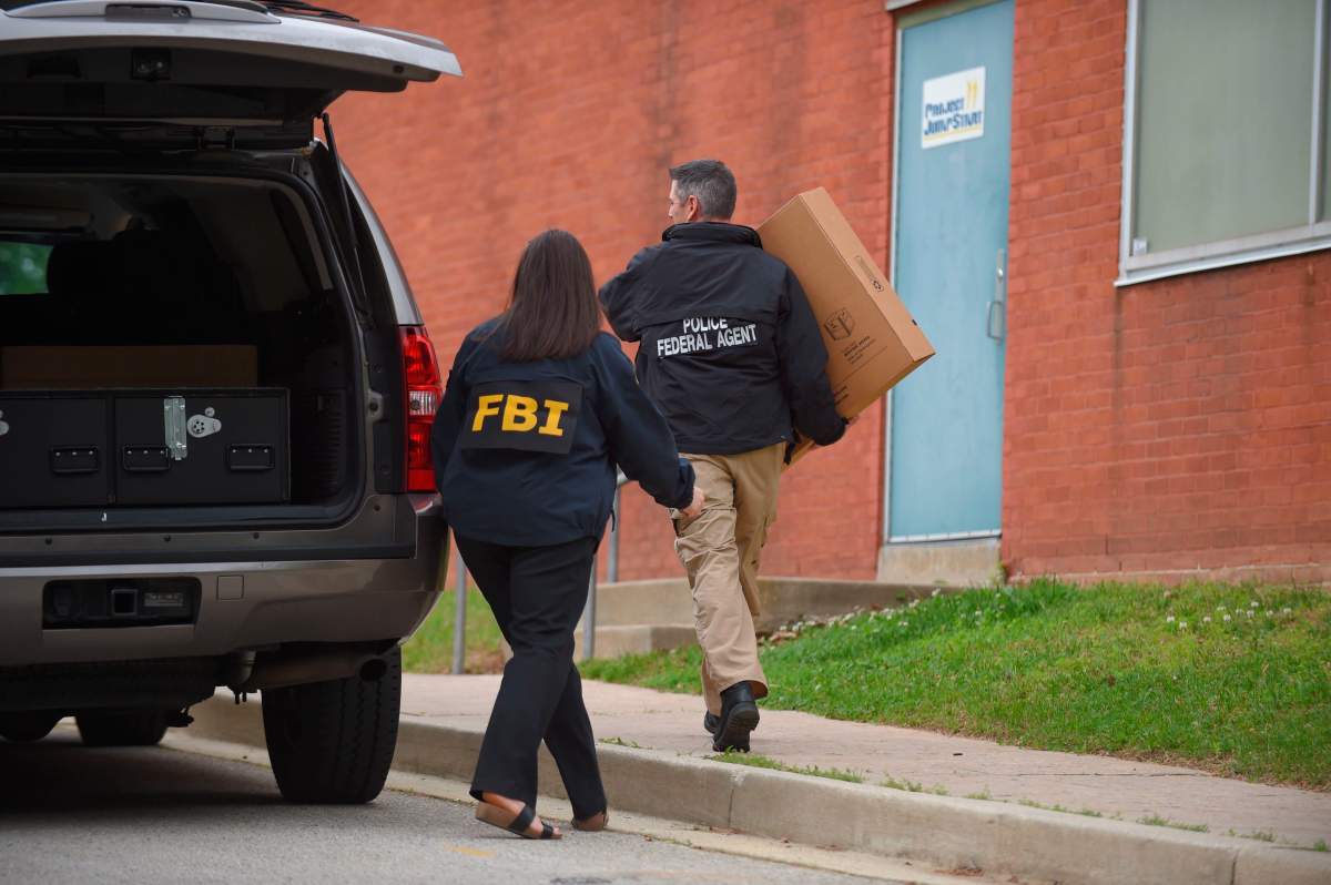 Federal agents arrive at the Maryland Center for Adult Training in Baltimore. Md., on Thursday, April 25, 2019. Agents with the FBI and IRS are gathering evidence inside the two homes of Baltimore Mayor Catherine Pugh and in city hall, as well as the office of her lawyer and the home of a top aide.