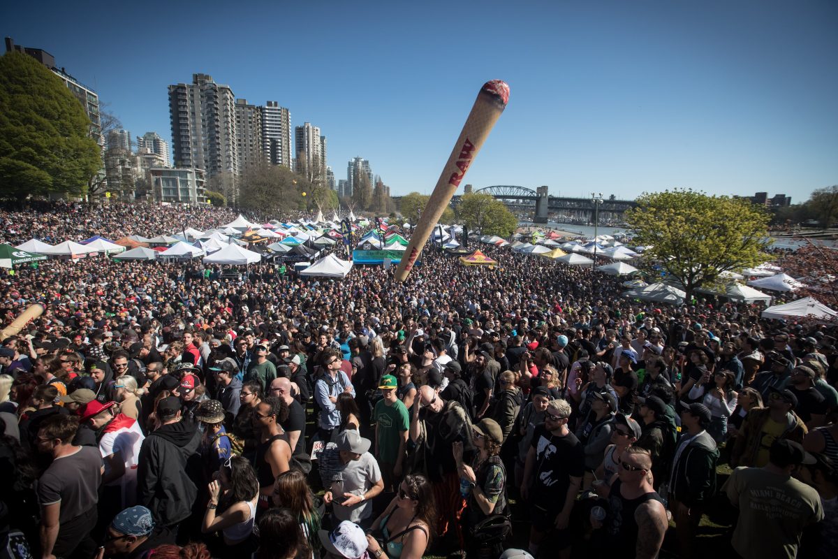 An inflatable shaped like a joint is tossed above the crowd during the annual 4-20 marijuana celebration in Vancouver on Saturday, April 20, 2019. 