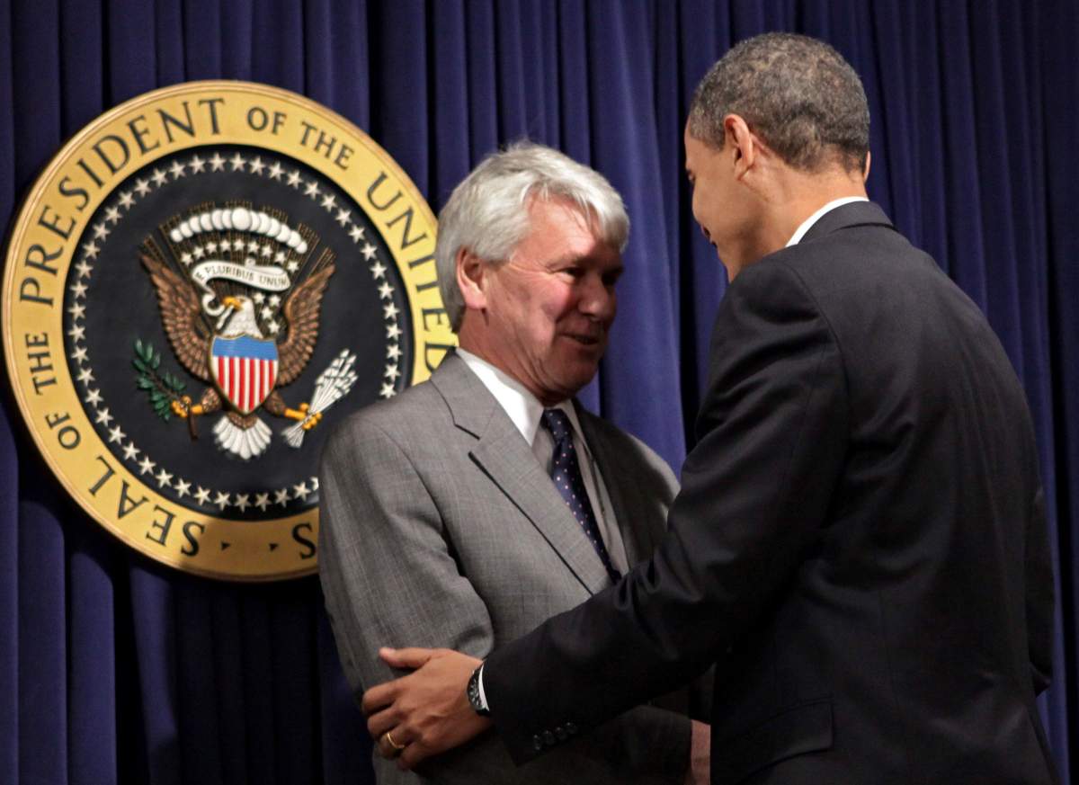 President Barack Obama, right, greets Greg Craig, left, his choice for White House counsel, as he meets with senior staff to assert expectations on ethics and conduct, at the Eisenhower Executive Office Building in the White House complex in Washington, Wednesday, Jan. 21, 2009.  