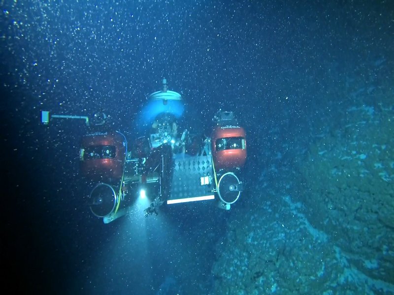 In this file image provided by Nekton on April 14, 2019, the submersible carrying Seychelles President Danny Faure is seen from a submarine belonging to Ocean Zephyr, during a descent into the Indian Ocean in the outer islands of Seychelles. 