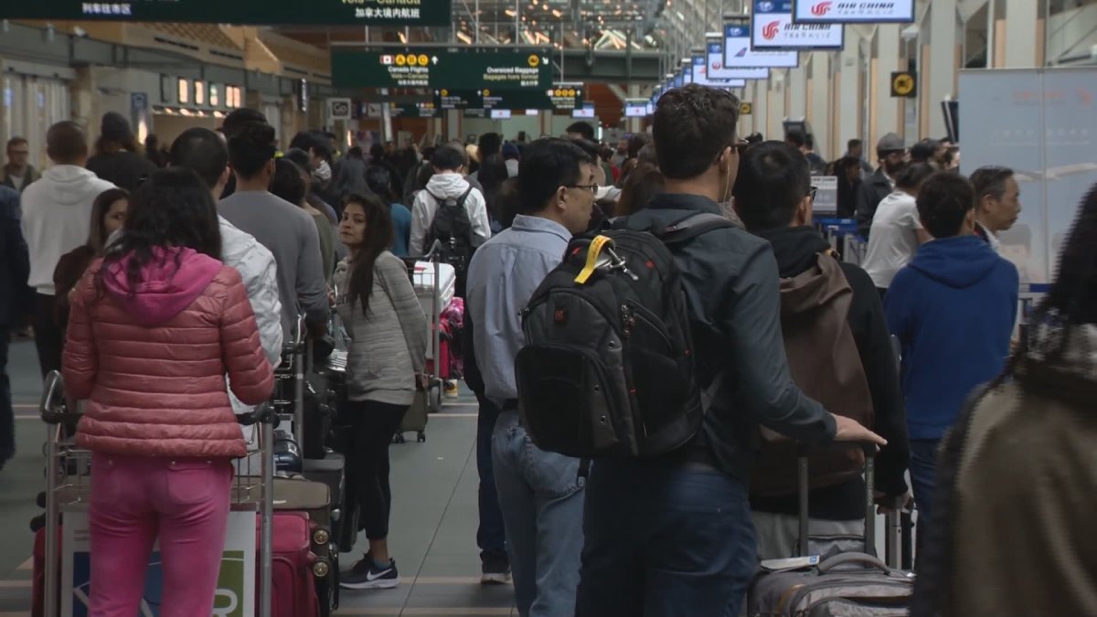 Long lines at Vancouver International Airport on Sunday were caused by a software issue that affected the check-in machines, the airport said.