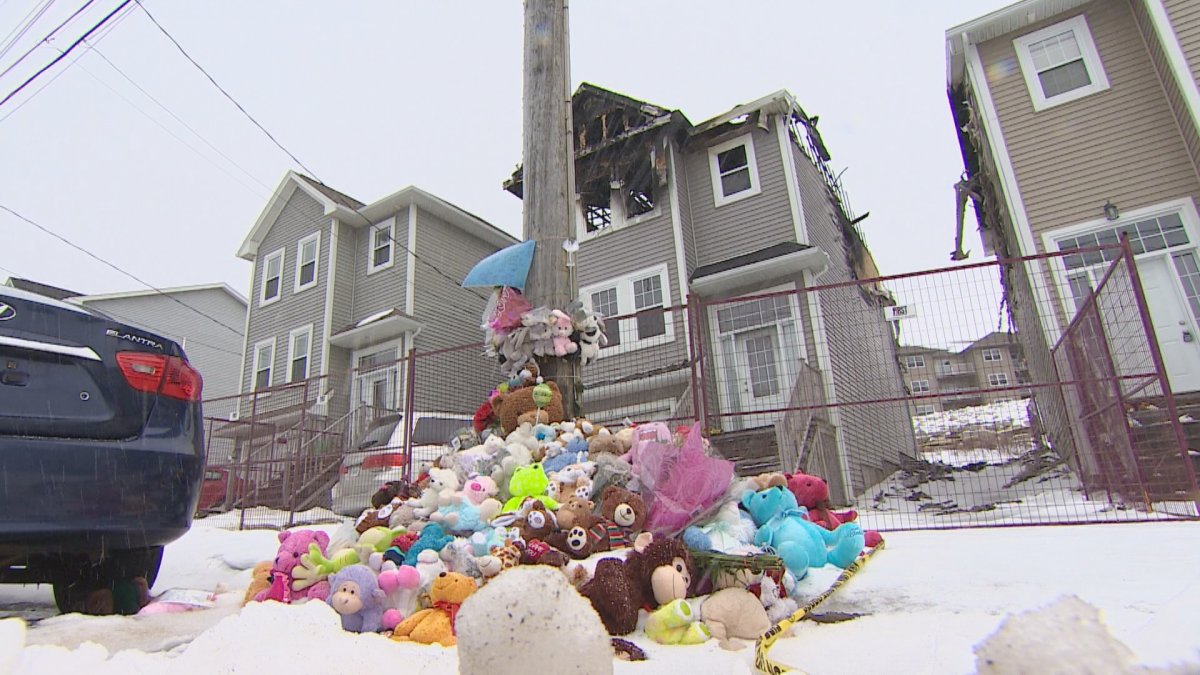 FILE - A makeshift memorial for the Barho family is seen outside their Halifax home following a devastating fire that killed seven children. 