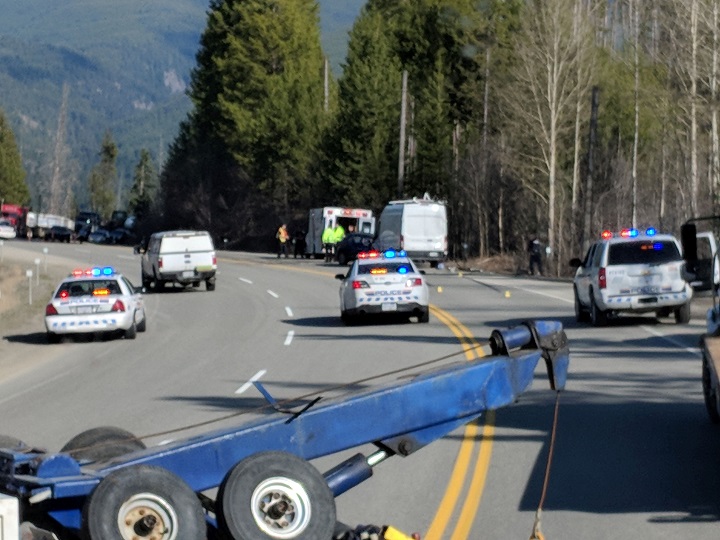 Emergency crews attend a fatal collision between a car and a van along Highway 3 on Wednesday afternoon.