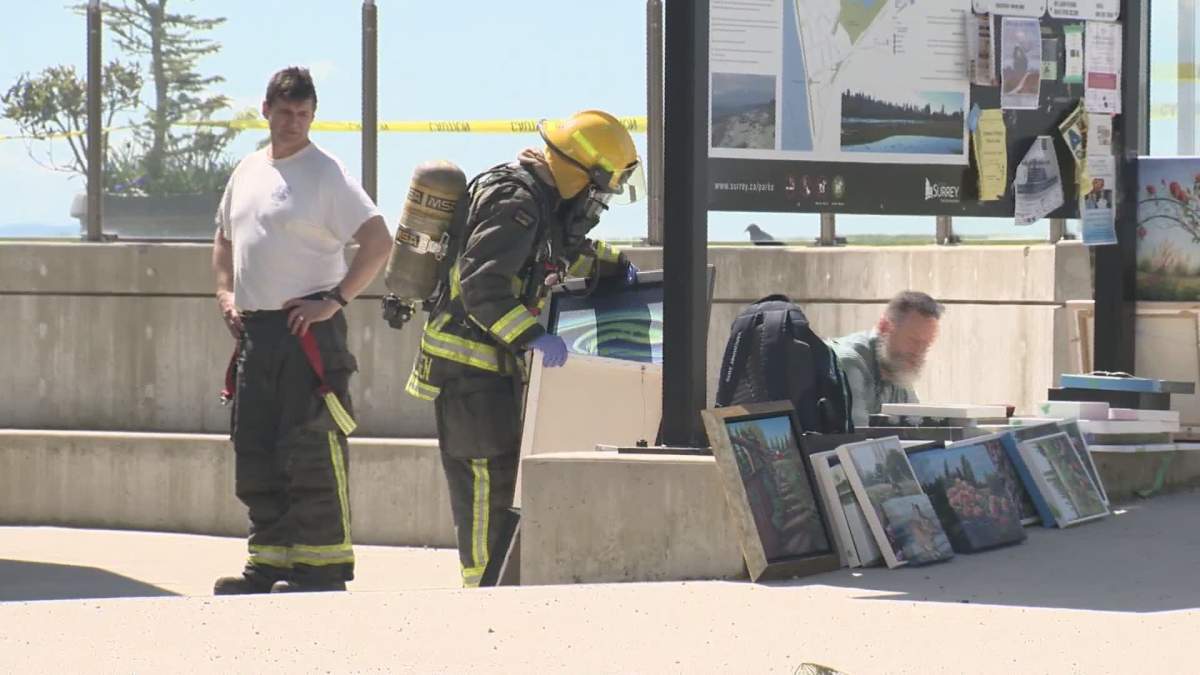 Firefighters remove paintings from Beecher Place.