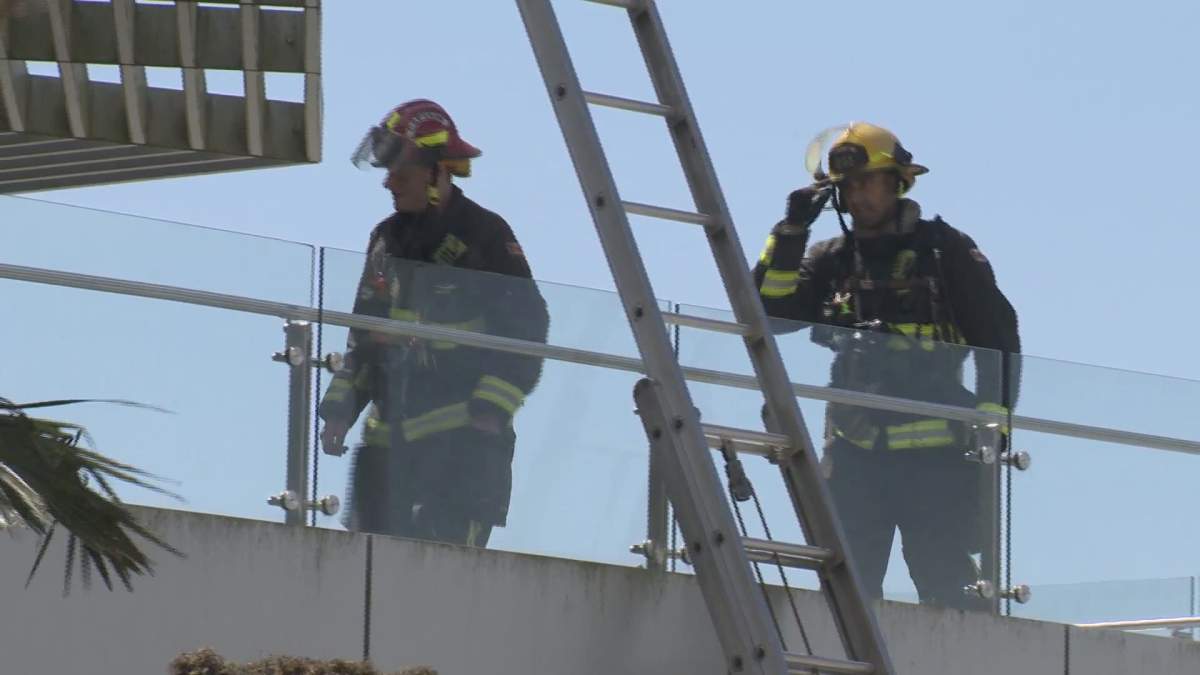 Crews work to extinguish a fire at Beecher Place in Crescent Beach on Monday. 