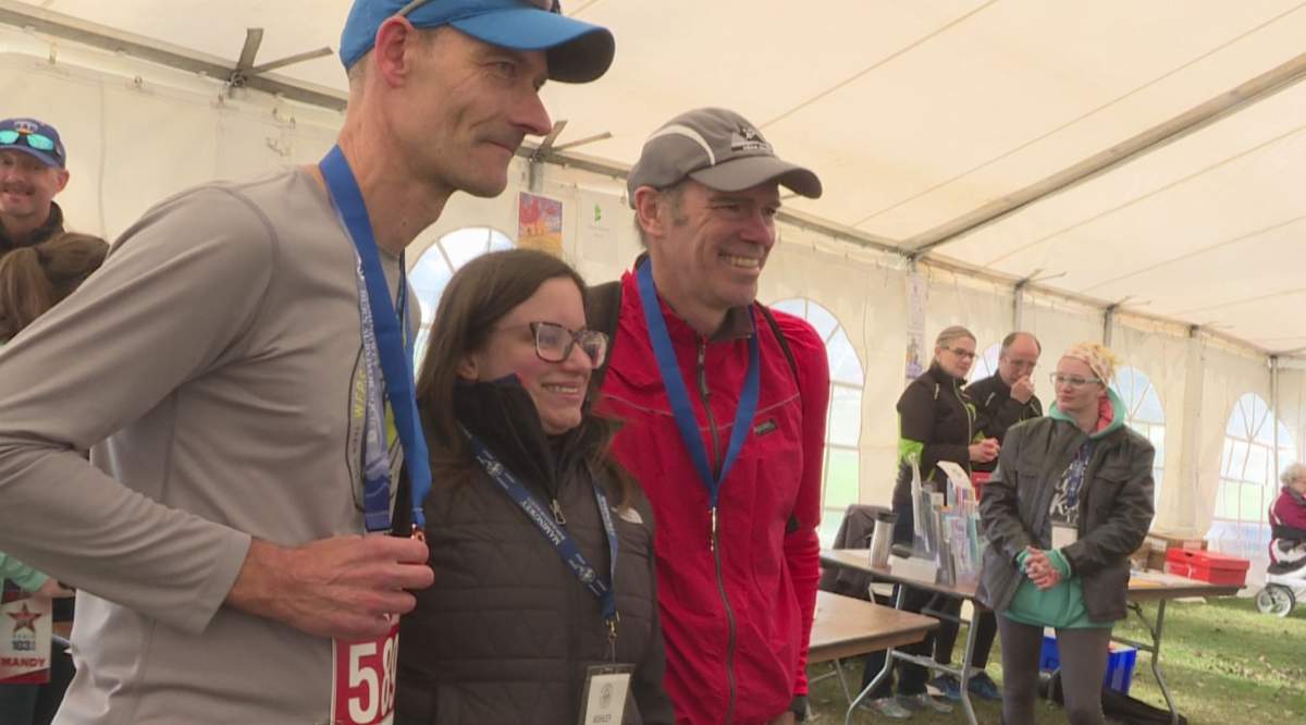 Race Director Ashley Wilson posing for a picture with the winners of Saturday’s ‘burn run’ at Assiniboine Park.