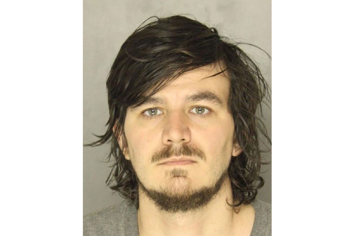 According to a criminal complaint, Cary Cocuzzi was charged after the woman found him in her bedroom last Saturday.