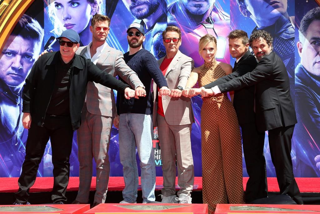 Marvel Studios President Kevin Feige, from left, poses with members of the cast of “Avengers: End Game,” Chris Hemsworth, Chris Evans, Robert Downey Jr., Scarlett Johansson, Jeremy Renner and Mark Ruffalo at a hand and footprint ceremony at the TCL Chinese Theatre on Tuesday, April 23, 2019, in Los Angeles. (Photo by Willy Sanjuan/Invision/AP)