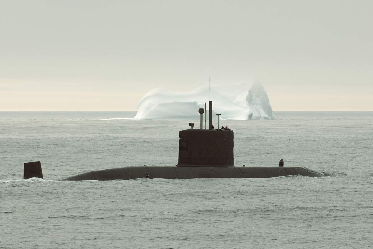 HMCS Corner Brook on arctic patrol during OP Nanook sails past an Iceberg.     