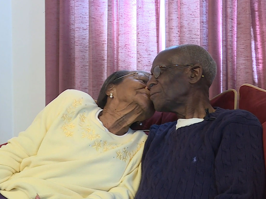 D.W. and Willie Williams sharing a kiss.