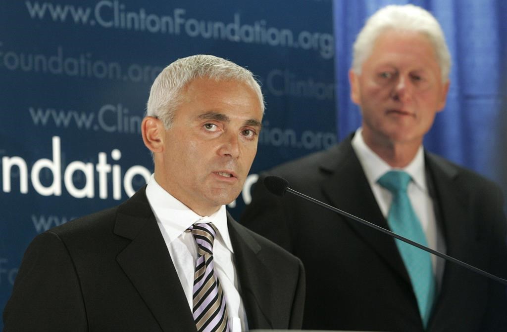 Frank Giustra, a Canadian businessman, speaks as former President Bill Clinton looks on during a news conference to announce the Clinton Foundation's launching of a new sustainable development initiative in Latin America Thursday, June 21, 2007 in New York. A British Columbia businessman and philanthropist is suing Twitter for publishing "false and defamatory" tweets that escalated during the 2016 United States election. Frank Giustra is the founder of Lionsgate Entertainment and CEO of the Fiore Group of Companies, and he's also a member of the board of trustees of the Clinton Foundation.