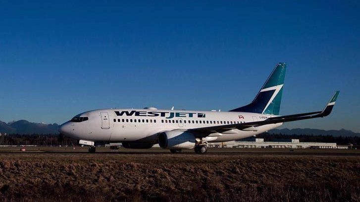 A man was arrested on a WestJet flight after he refused to co-operate with police on Sunday night in Kelowna.