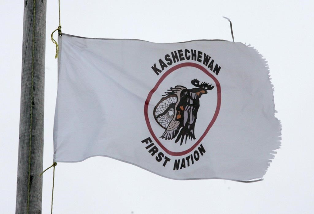 A tattered Kashechewan First Nation flag flies outside St. Paul's Anglician church on the Kashechewan native reserve in northern Ontario Sunday, Oct. 30, 2005. 