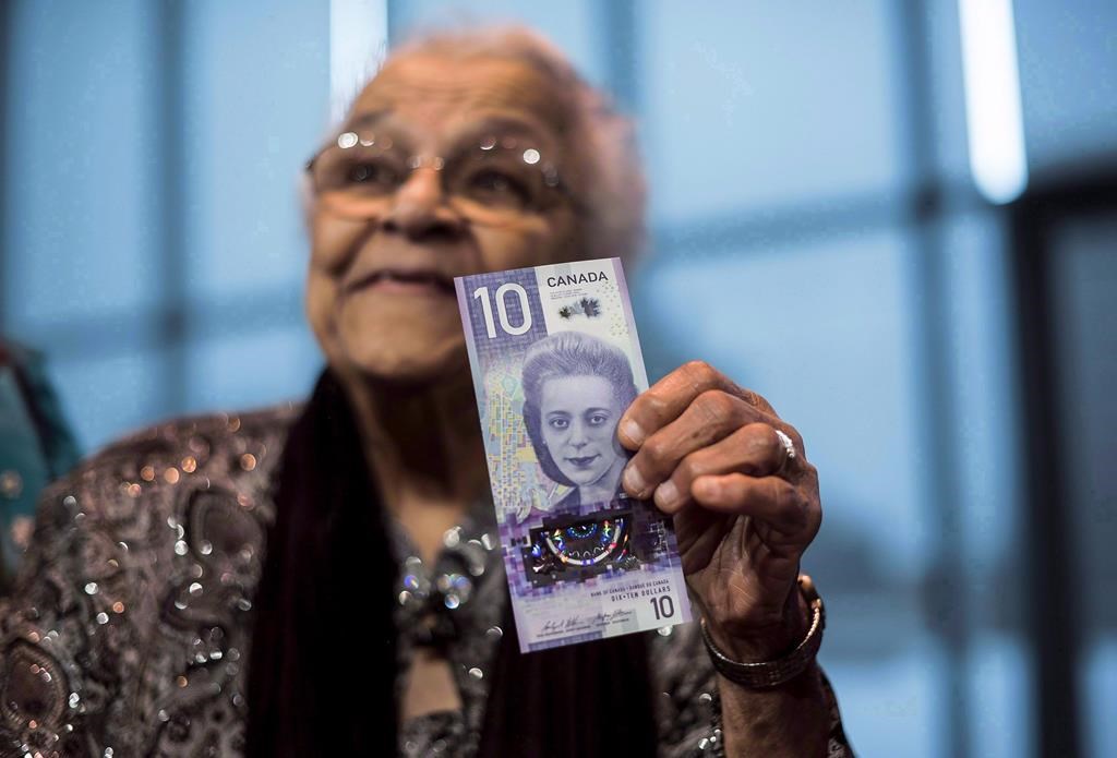 Wanda Robson, sister of Viola Desmond, holds the new $10 bank note featuring Desmond during a press conference in Halifax on March 8, 2018.