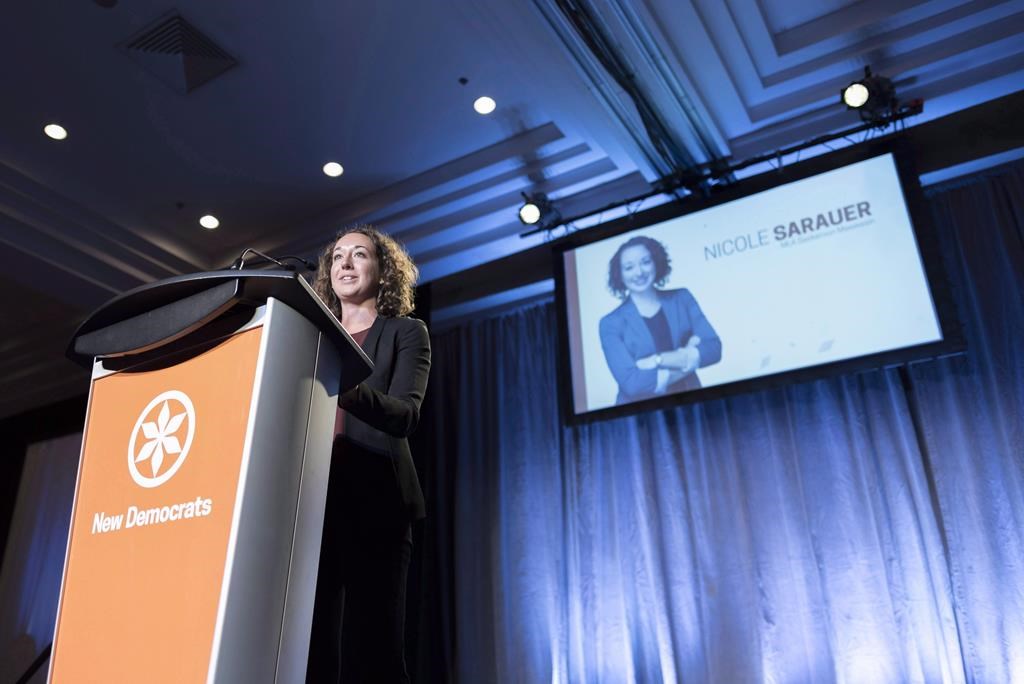 NDP MLA Nicole Sarauer speaks during the Saskatchewan New Democrats leadership convention at the Delta Hotel in Regina, Saskatchewan on Saturday March 3, 2018. THE CANADIAN PRESS/Michael Bell.
