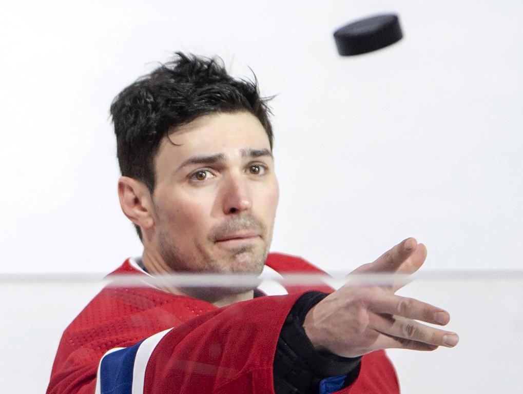 Montreal Canadiens goaltender Carey Price (31) tosses a puck to the fans after defeating the Detroit Red Wings during third period NHL hockey action Tuesday, March 12, 2019 in Montreal.