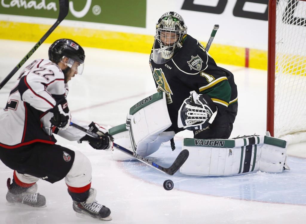 Rouyn-Noranda Huskies’ Peter Abbandonato, left, shoots on London Knights goalie Tyler Parsons during first period CHL Memorial Cup hockey action in Red Deer, Tuesday, May 24, 2016.