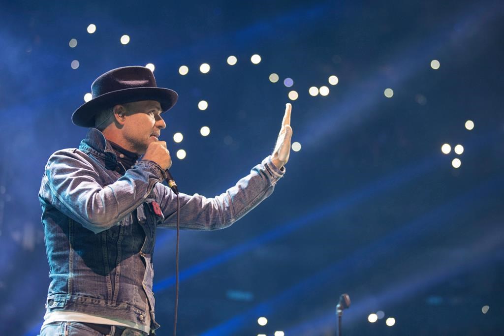 Gord Downie performs at WE Day in Toronto on Wednesday, October 19, 2016. People are invited to sing The Hip's 'Bobcaygeon' to support the village during the coronavirus pandemic.