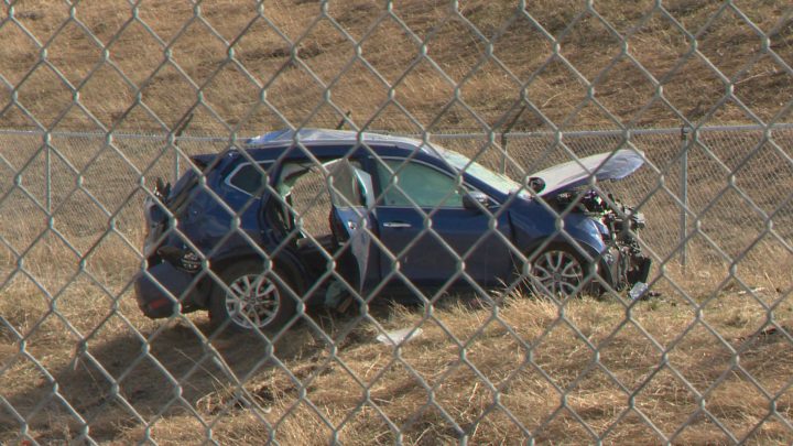 Calgary police said a vehicle hit an embankment, flew through the air, went through a fence and landed in the ditch, narrowly missing a pond on Saturday afternoon.
