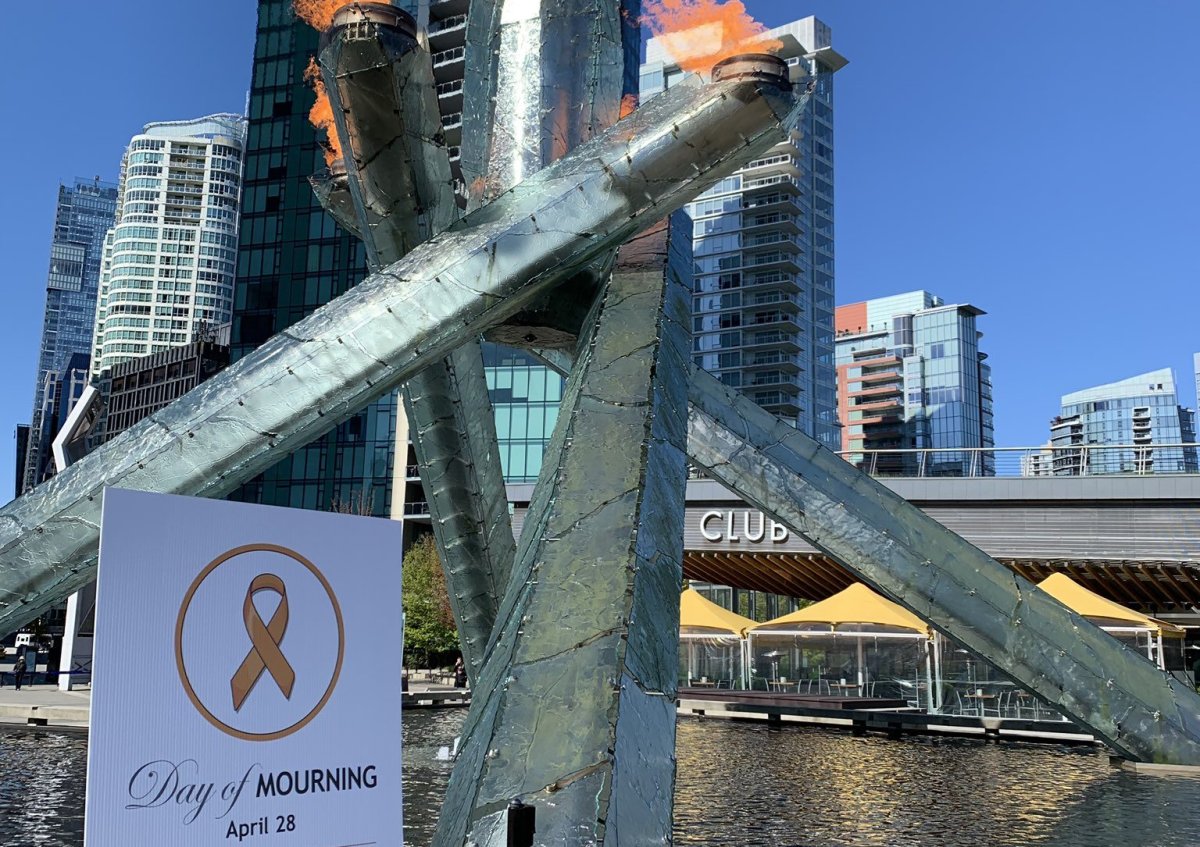 The Olympic Cauldron at Jack Poole Plaza in downtown Vancouver is lit in honour of workers killed or injured on the job during the National Day of Mourning ceremony Sunday, April 28, 2019.