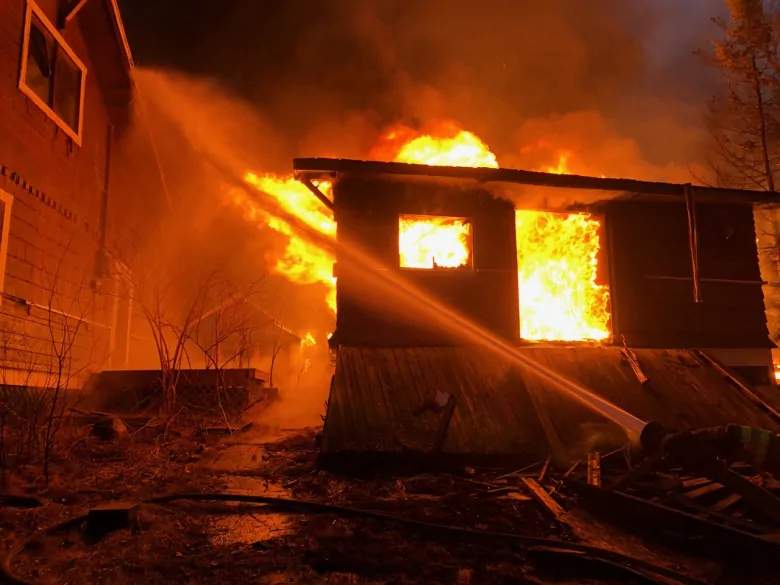 A cottage burns in Devil's Gap. 