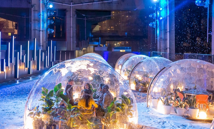"Dinner With a View," in which a minimum $550 purchase allows a party of four to nosh in a clear heated dome under the Gardiner Expressway, runs until May 2.