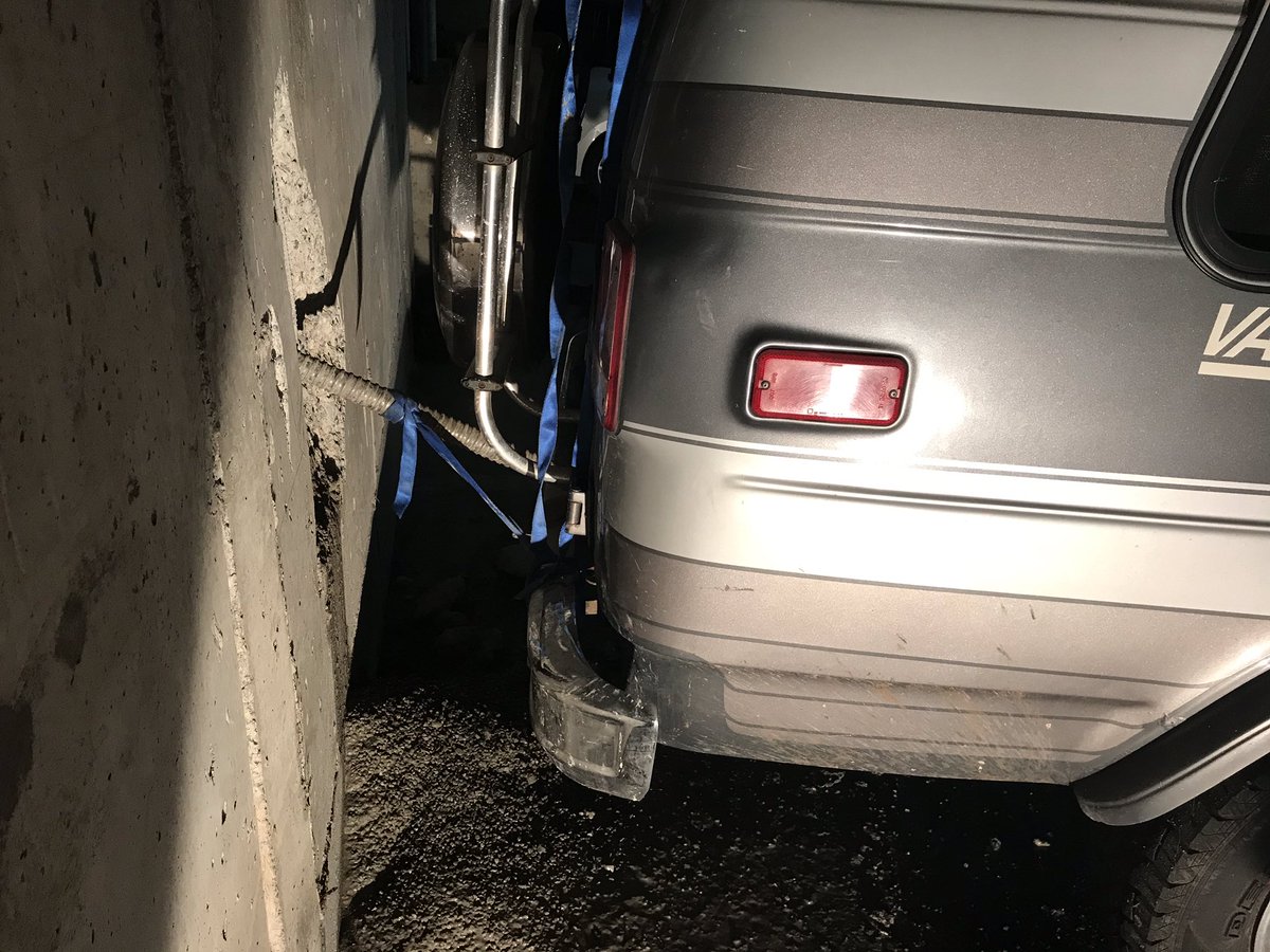 Firefighters say an "errant drill" pierced a wall and a vehicle's fuel tank on Thursday morning. 