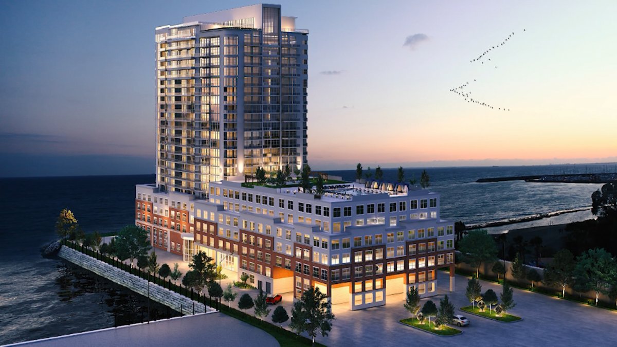 Kingston developer unveiled plans for a 20 storey apartment building and 5 storey parking podium next to historic dry dock property,.