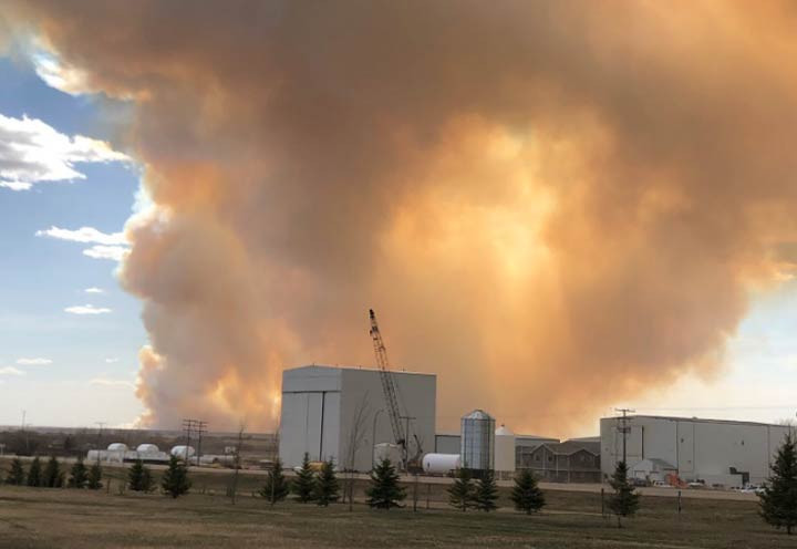 Biggar RCMP said they’re assisting with evacuating an area as an "out-of-control" grass fire burns southwest of the Saskatchewan town.