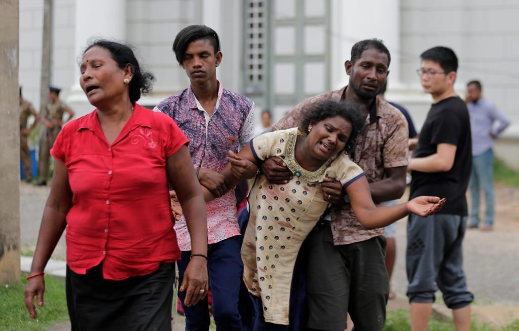 Relatives of a blast victim grieve outside a morgue in Colombo, Sri Lanka, Sunday, April 21, 2019. (AP Photo/Eranga Jayawardena)