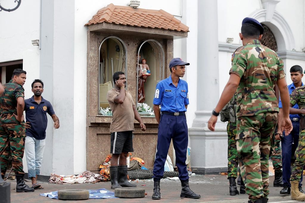 People gather outside St. Anthony’s Shrine where a blast happened, in Colombo, Sri Lanka, Sunday, April 21, 2019. (AP Photo/Eranga Jayawardena)