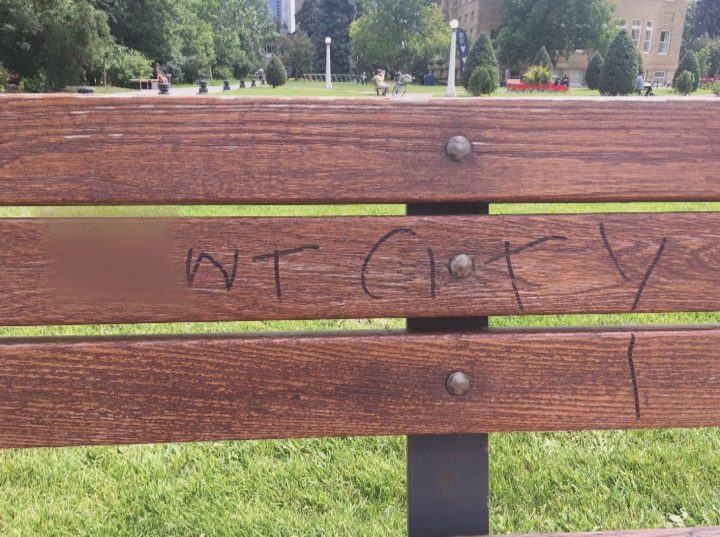 An obscene message, blurred by Global News, on a City of Calgary park bench.