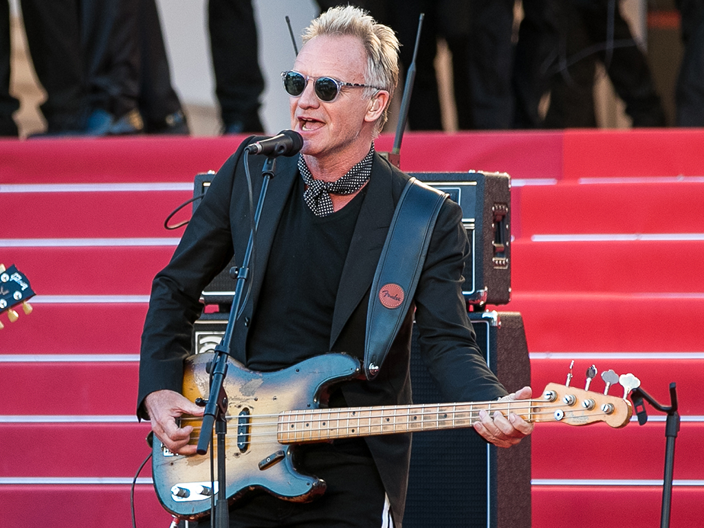 Sting performs on the red carpet steps as jury members and award winners, behind, look on during the 71st annual Cannes Film Festival at Palais des Festivals on May 19, 2018 in Cannes, France.  