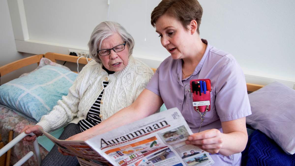 Nurse Hanna-Leena Latva assists resident Raili Huhtala at the public eldery care unit Heikanrinne in Forssa, Finland April 2, 2019. Picture taken April 2, 2019.