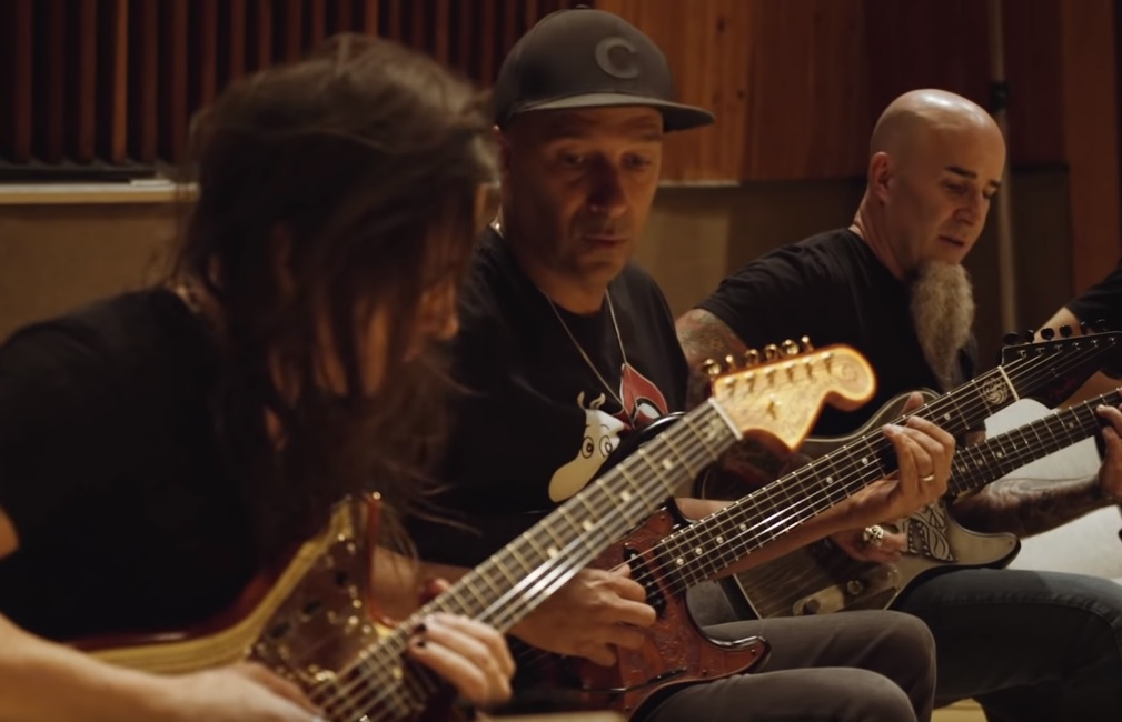 From left, Nuno Bettencourt of Extreme, Tom Morello — formerly of Rage Against the Machine, and Scott Ian of Anthrax test out Fender’sGame of Thrones inspired guitars.