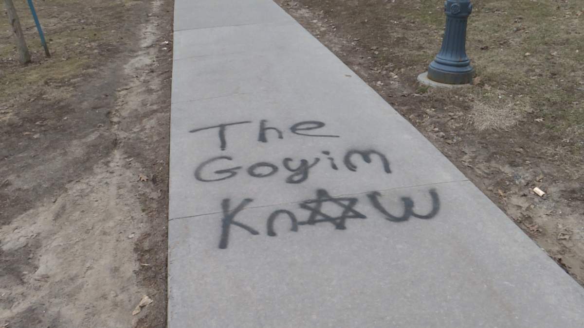 Kingston police have released security images that may have captured the man who spray painted racist messages across the city on April 5.