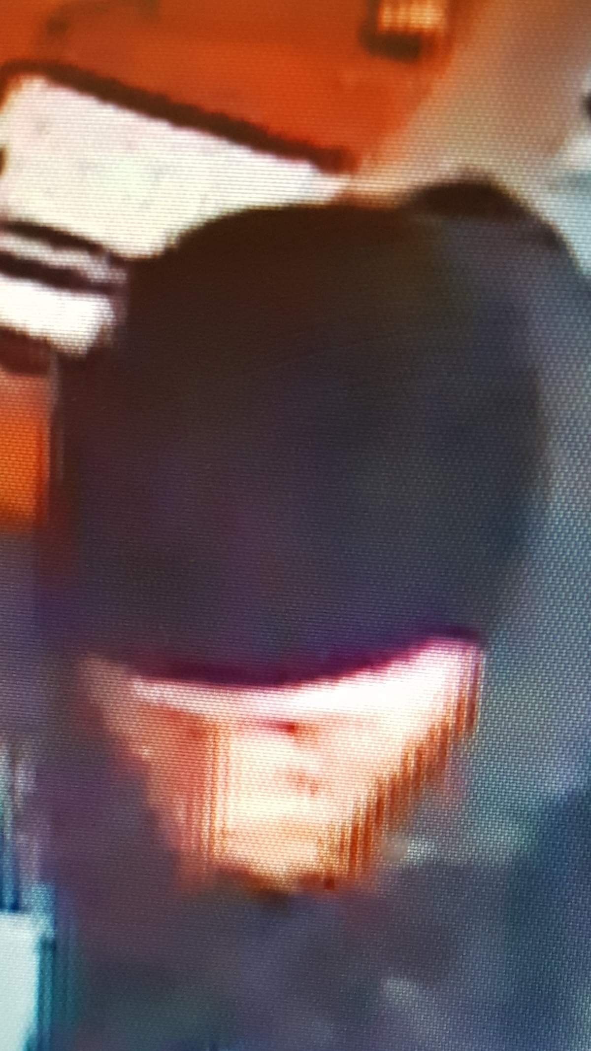 A surveillance image of the suspect in an alleged theft from Hiawatha Smoke Shop.