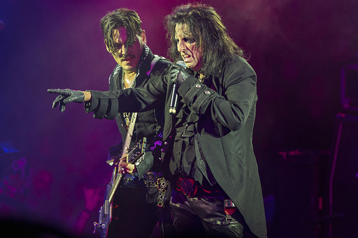 Johnny Depp (L) and Alice Cooper of Hollywood Vampires perform on stage at Celebrity Theatre on Dec. 8, 2018, in Phoenix, Ariz.