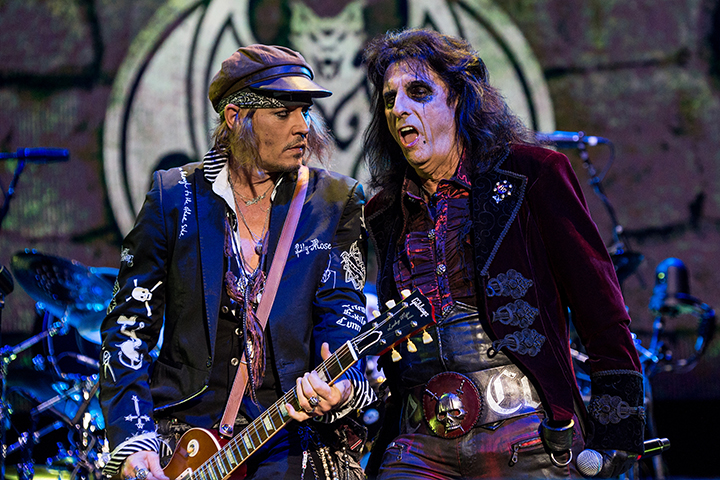 Johnny Depp (L) and Alice Cooper of Hollywood Vampires perform live on stage at Wembley Arena on June 20, 2018 in London, England.