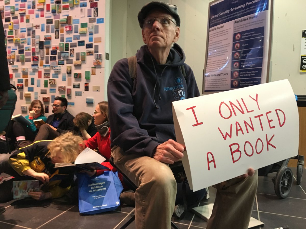 A protester outside the main entrance of the Millennium Library.