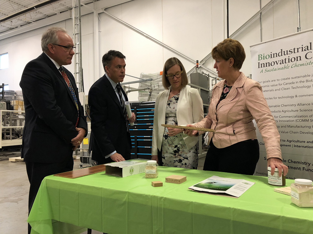 (from left to right) Bioindustrial Innovation Canada executive director A.J. "Sandy" Marshall and Ecosynthetix CEO Jeff MacDonald show Burlington MP and Minister of Democratic Institutions Karina Gould and Minister of Agriculture and Agri-Food Marie-Claude Bibeau some of the eco-friendly products made at the Burlington company.