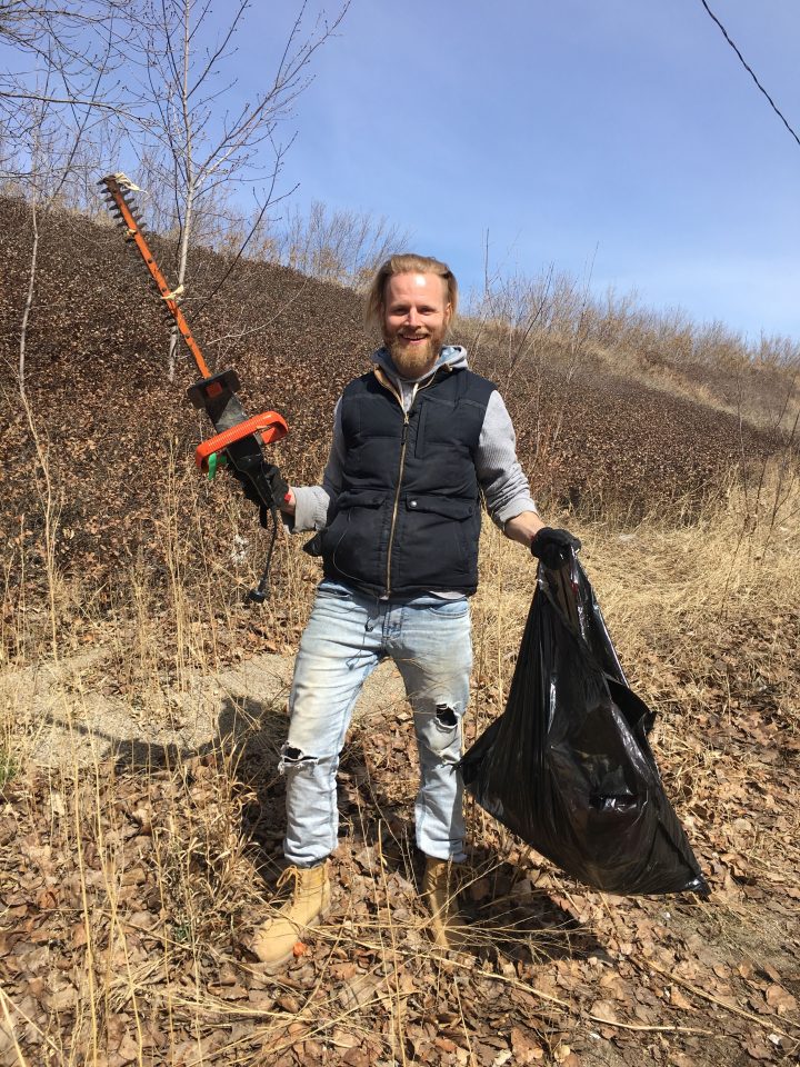 Jesse Boldt holding some hedge trimmers he found on the ground.