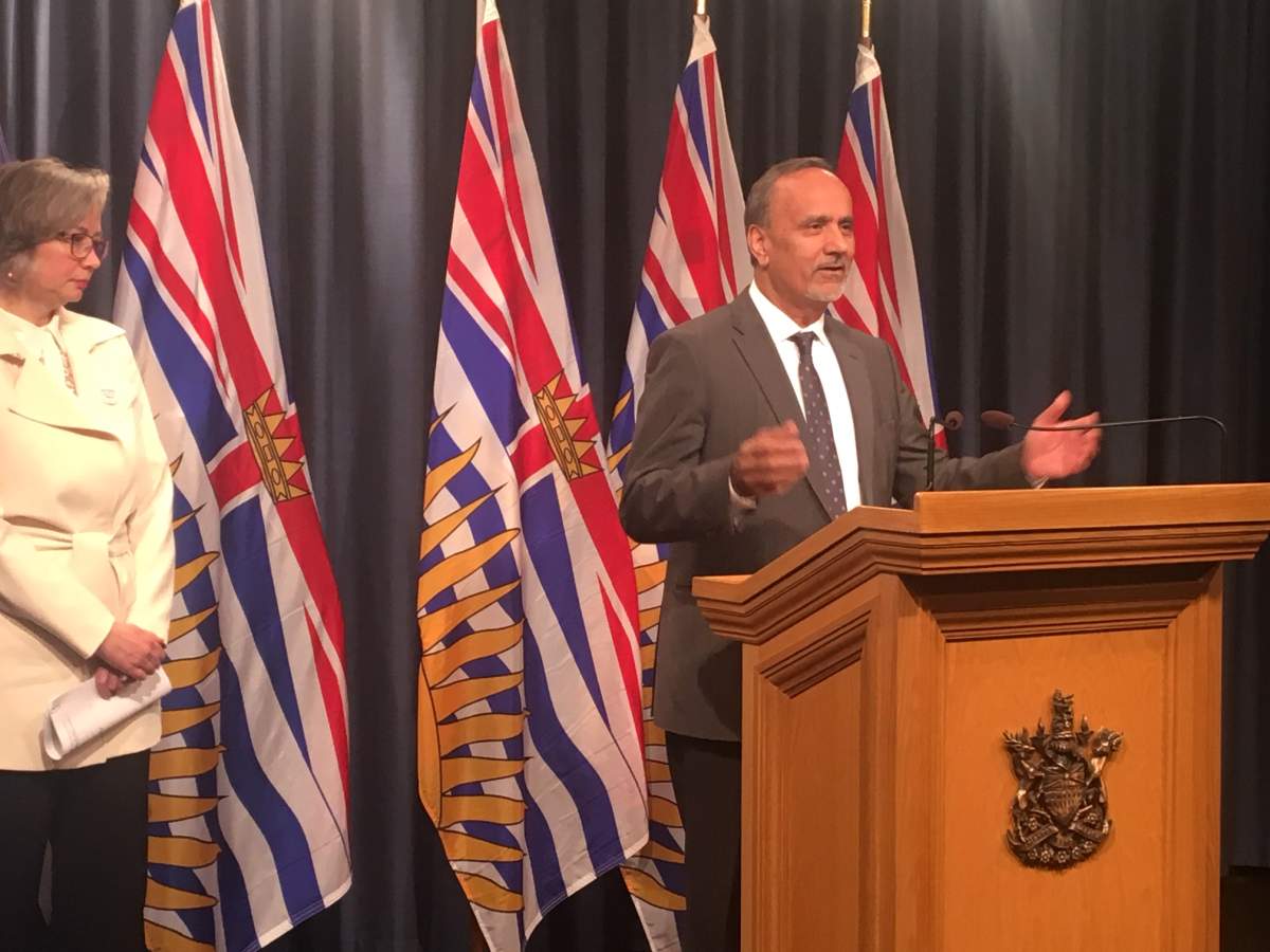Labour Minister Harry Bains speaks to areporters in Victoria following the introduction of legislation changing the provincial labour code.