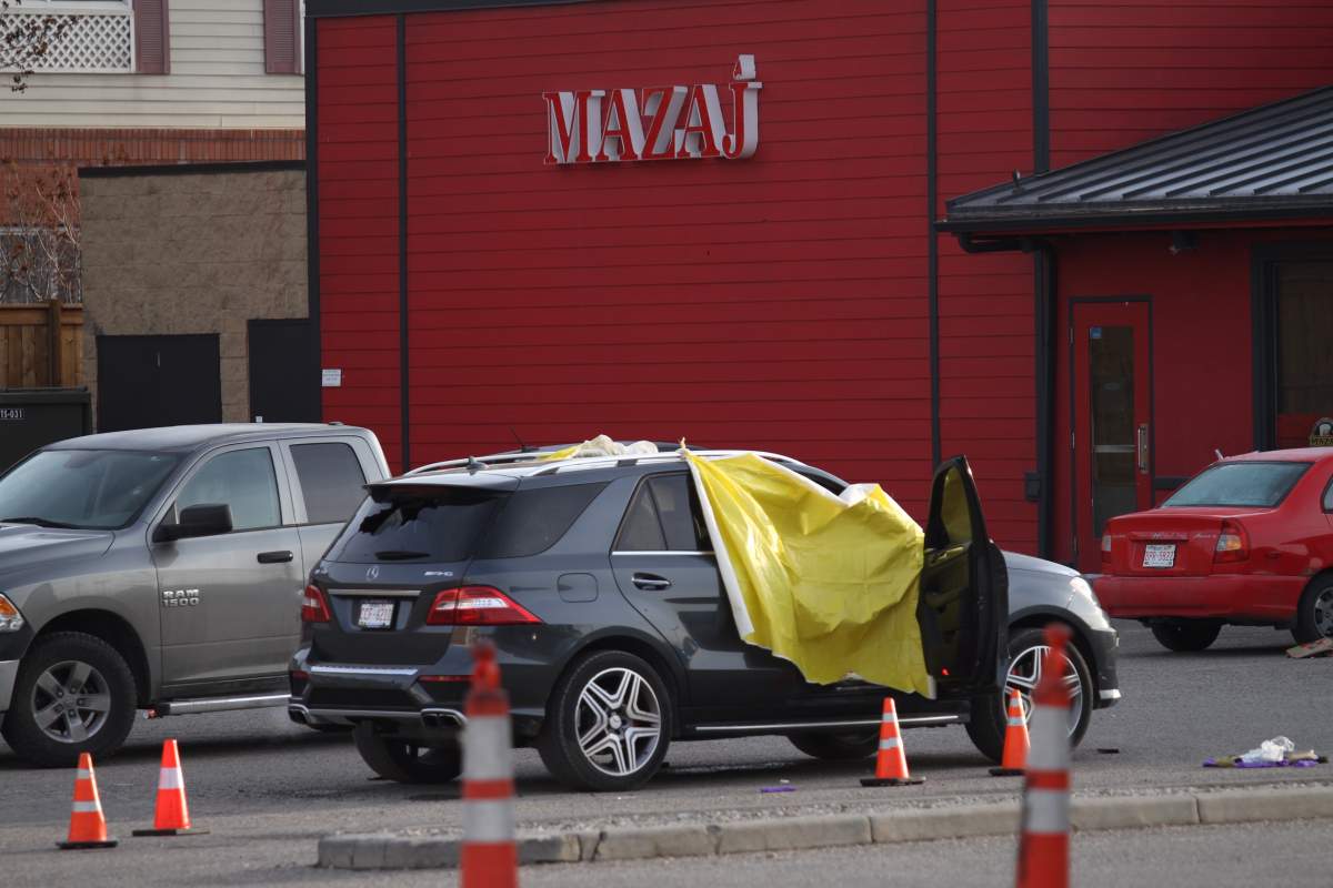 Calgary police investigate a deadly shooting in the parking lot outside Mazaj Lounge and Restaurant on Wednesday, April 3, 2019.