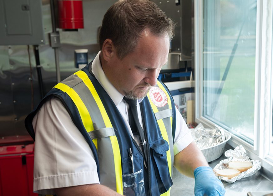 Jeffrey Robertson, the Salvation Army’s divisional director of emergency and disaster services, prepares food in one of the charity’s canteens in Ottawa after two tornadoes devastated several communities in the city.