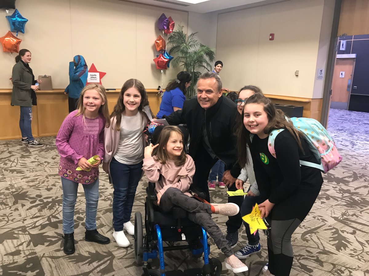 Former Blue Jays manager John Gibbons poses with children ahead of the London Sports Celebrity Dinner and Auction at the London Convention Centre. 