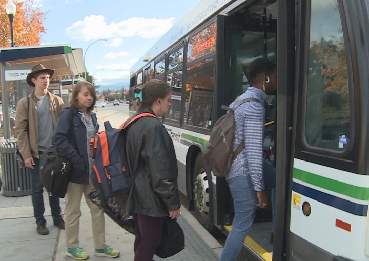 Transit users in Kelowna boarding a bus