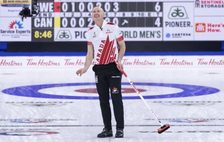 Canada skip Kevin Koe watches his final shot on the screen in their game against Sweden at the world men's curling championship in Lethbridge, Alta. on Wednesday, April 3, 2019. 