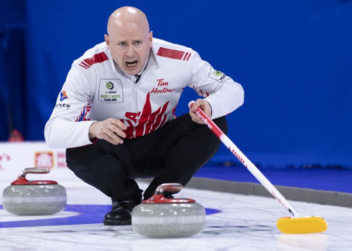 Canada skip Kevin Koe calls for the sweep on a shot in their game against Scotland during the qualification games at the Men's World Curling Championship in Lethbridge, Alta. on Saturday, April 6, 2019. 